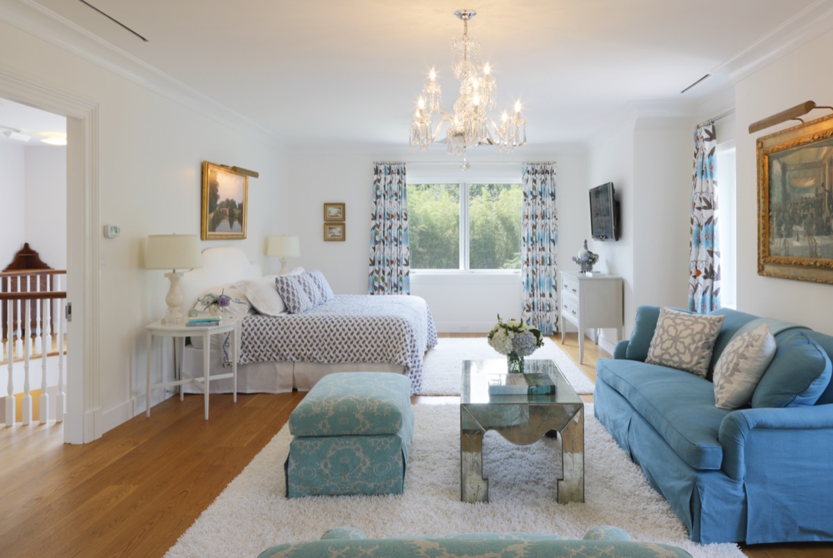 Guest room with a four-poster bed and blue sofa, Princeton NJ